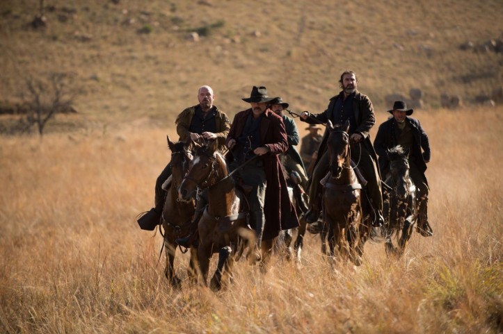 The 'bad guys' with Eric Cantona riding high in the saddle (second right) and lead by 
